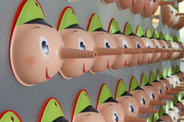 A fact checker hangs up his Pinocchios